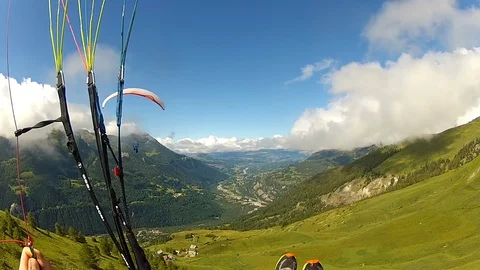Paragliding POV view from action camera, flying with parachute in mountains. Stock Footage 128181636