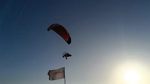 Paragliding sky flying machine in a runn of kutch white dessert Stock Footage 236016605
