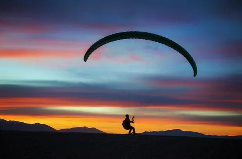 Paragliding at sunset Stock Photos