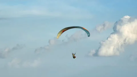 Paragliding tandem flight through clouds in Bali Stock Footage 330216853