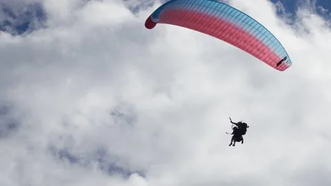 Paragliding under the clouds and sun Video stock 196737831