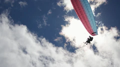 Paragliding under the sun and clouds Video stock 196737878