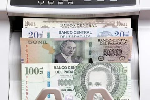 Paraguayan guarani in the counting machine Stock Photos