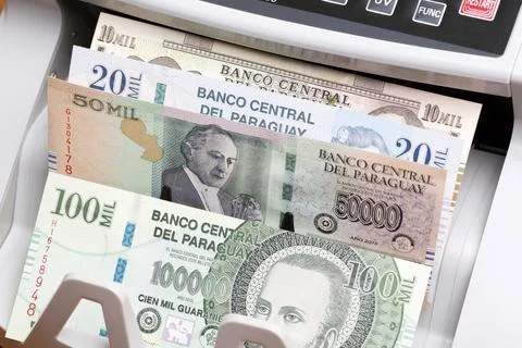Paraguayan guarani in the counting machine Stock Photos