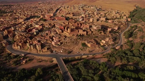 Parallax ascent and push in above Tinghir ksar and desert valley in Morocco Stock Footage 336472123