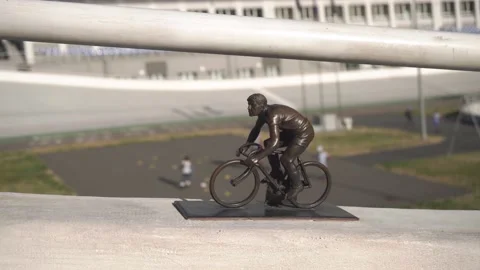 Parallax, Camera movement side. Figurine cyclist, background cycle track Stock-Footage 224556233