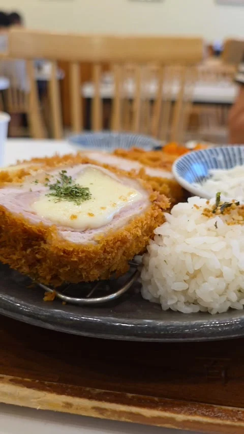 Parallax Close-Up Vertical Shot of Cheese Tonkatsu in Korean Restaurant on Stock-Footage 313985336
