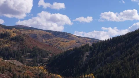 Parallax drone shot of fall mountains, 70mm 스톡 동영상 252568088