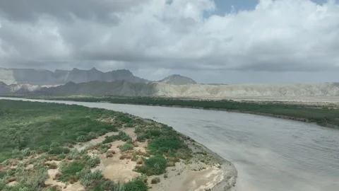 Parallax drone shot of long range of mountains and hills with clouds on Stock Footage 262328684
