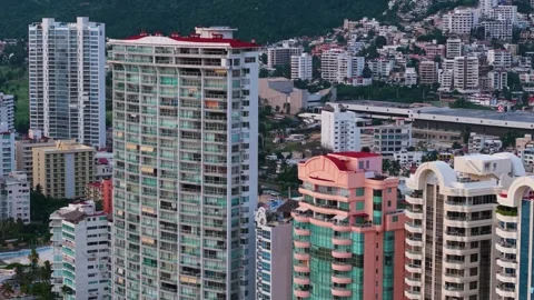 Parallax drone shot retreating over Acapulco’s coastline, Mexico Stock-Footage 320946965