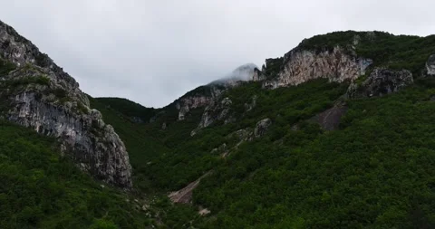 Parallax Of Humid Mountain Top With Sharp Cliff Edges Covered In Tundra Greens Stock-Footage 300442407