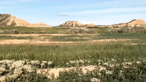 Parallax profile shot of fields and mountains Stock-Footage 128753669