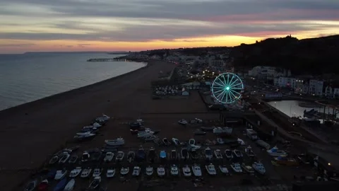 Parallax Tilt-Down Drone Shot Raising Over Eastbourne Beach and Ferris Stock Footage 291913981