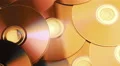 parallax tracking shot over a pile of discs 8/8 4k or 4k+ Resolution