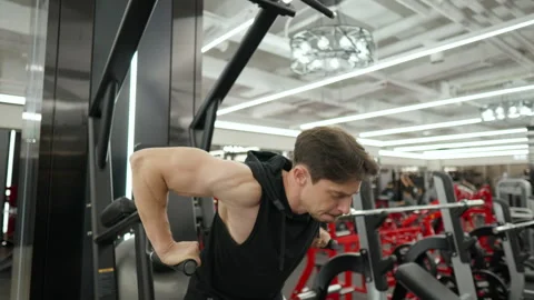 Parallel Bar Dips. Mid age Muscular Man Trains Lower Chest Doing Exercises Video stock 254680136