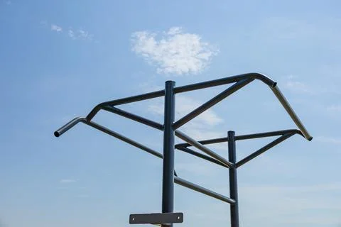 Parallel bars set against a clear blue sky encourage athletes to engage in .. Foto stock
