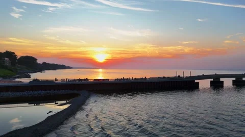 Parallel Drone Flight Along Pier at Sunset with Fishermen 4K Vídeo Stock 332173198