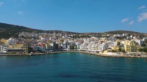 Parallel Drone Flight over Pigadia Seafront in Karpathos on a Sunny Day Vídeo Stock 316601955