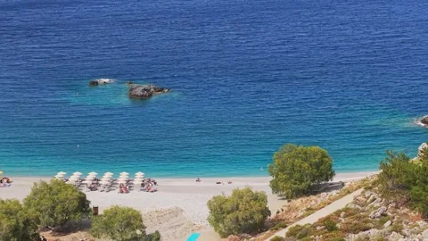 Parallel Drone Flight Revealing the Shoreline of Achata Beach in Karpathos Stock Footage 316200287