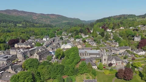 Parallel Drone Movement Revealing Pitlochry Village and Surrounding Nature Stock-Footage 316042257