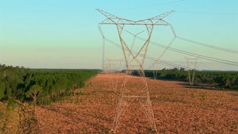 Parallel drone view of high voltage Yacireta power lines crossing over Stock Footage 313280207