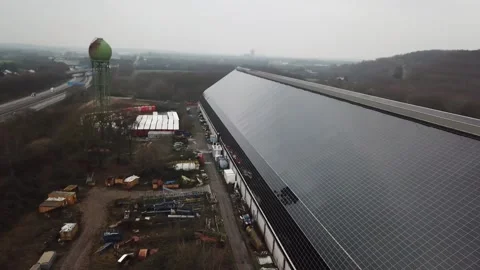 Parallel flight along solar facade with birds passing Stock Footage 331894994