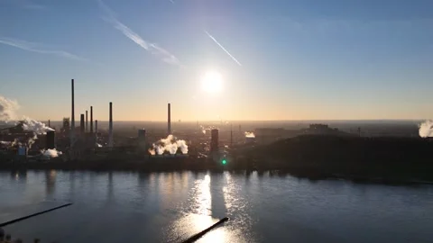 Parallel flight with river reflections beside coking plant Video stock 331203164