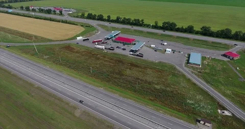 Parallel lines of free and tollway roads are passing through agricultural fields Stock Footage 99552528