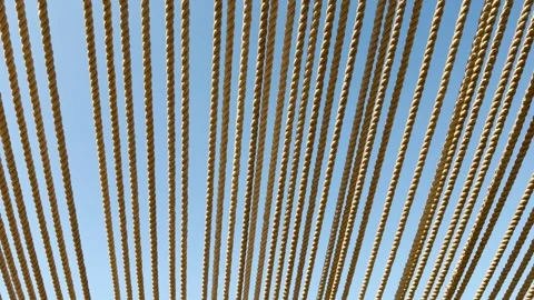 Parallel Manila Ropes Stretch Across A Clear Blue Sky As Sun Shade 動画素材 334035791