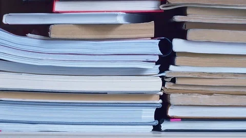 Parallel movement from left to right along book shelve. Old and new books are Video stock 119000186