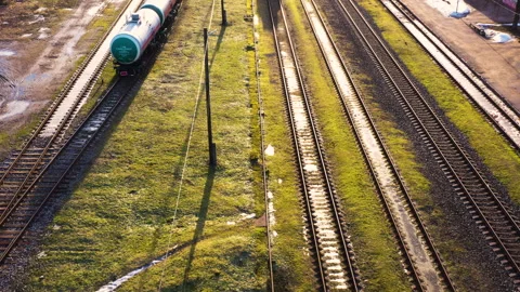 Parallel raidroad tracks with standing waggons and engine, aerial flyover, Stock-Footage 269003183
