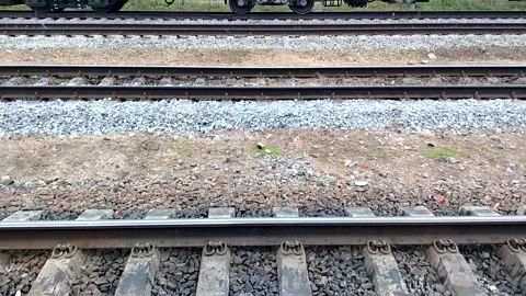 Parallel railroad tracks and concrete sleepers on ballast at station slow pan le Stock Footage 326209924