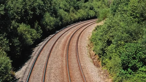 Parallel Railroad Tracks with Concrete Underlay and Crushed Stones Ballast Track Stock Footage 278408660