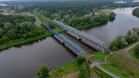 Parallel Railway Bridges Crossing River in Rural Landscape Stock-Footage 296558752