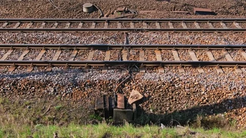 Parallel Railway Track with Electric Cables and Train Sensor on Rock Ballast Video stock 305951582