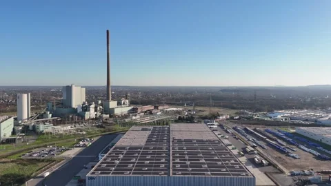 Parallel river view of logistics hub with warehouse roofs Video stock 331205264