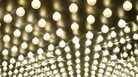 Parallel rows of glowing lamps. Abstract background. Edison vintage light bulbs 스톡 동영상 115657485