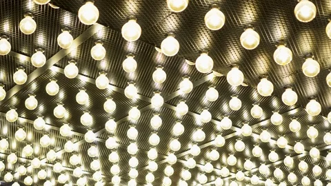 Parallel rows of glowing lamps. Abstract background. Edison vintage light bulbs Stock Footage 115657640