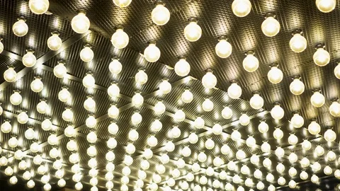 Parallel rows of glowing lamps. Abstract background. Edison vintage light bulbs Stock Footage 115657846