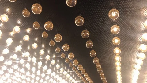 Parallel rows of glowing lamps. Abstract background. Edison vintage light bulbs Stock-Footage 127096752