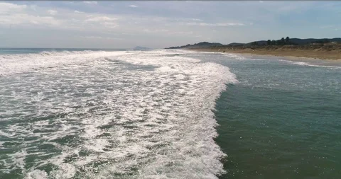 Parallel side drone flight of wave with green foam Stock Footage 124374650