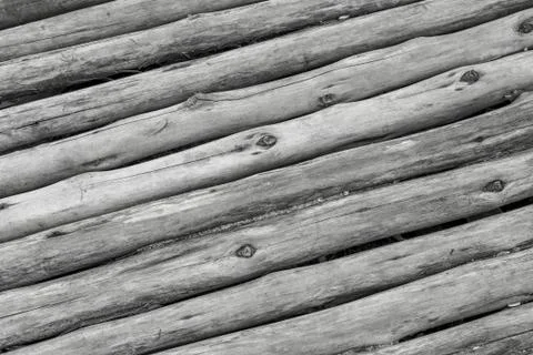 Parallel slanted gray logs thin old boards twig wooden surface toned surface Stock Photos