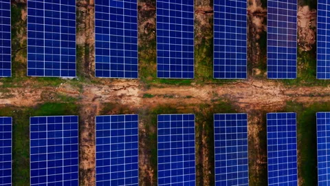 Parallel solar panel rows across flat field, Bulgaria Stock Footage 336724615