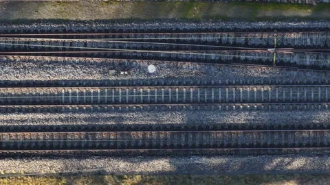 Parallel Train Tracks in Swiss Landscape - aerial top view Stock Footage 264814561