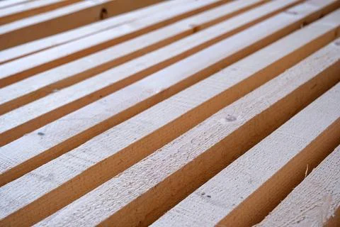 Parallel wooden strips for frame construction, wall partitioning, mounting,.. Stock Photos