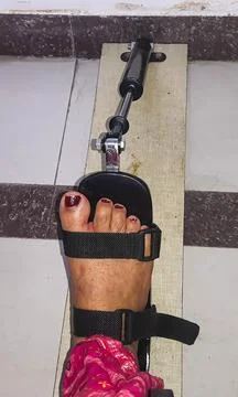 Paralyzed limb undergoing foot mobility training inside 스톡 사진