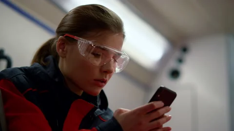 Paramedic ambulance texting message on mobile phone in emergency car 스톡 동영상 166882991