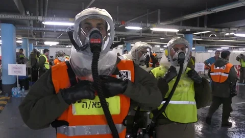 Paramedic and physician dressing protective suits against chemical substances Stock Footage 81447633