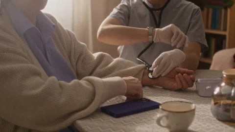 Paramedic Checking Senior Womans Pulse Stock Footage 335880476