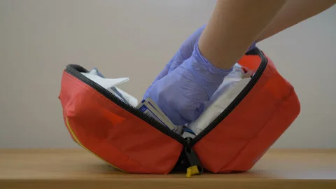 Paramedic is closing first aid kit HD Stock Footage 130232363